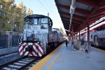 A Caltrain extra move consisting of a switcher pulling some Gallery cars pauses on Track 9